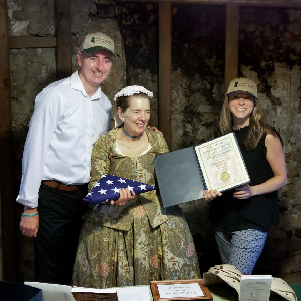 US Congressman Brian Fitzpatrick and State Representative Meghan Schroeder present Wendy Wirsch with the Congressional Flag